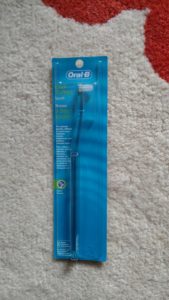 end-tufted brush, in package